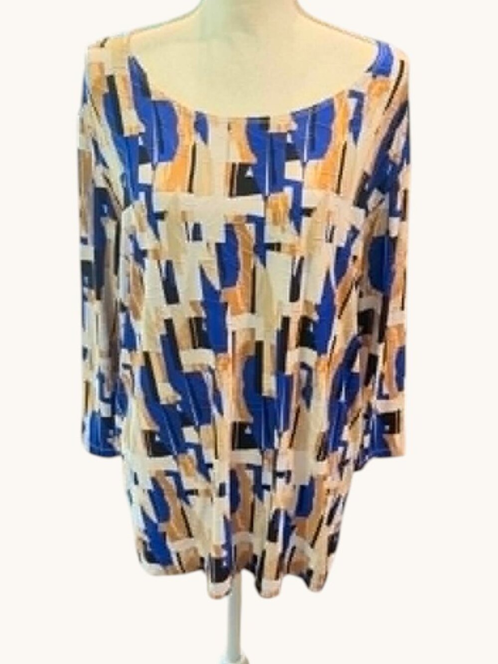 JM Collection top features a vibrant blue, tan, black geometric abstract print